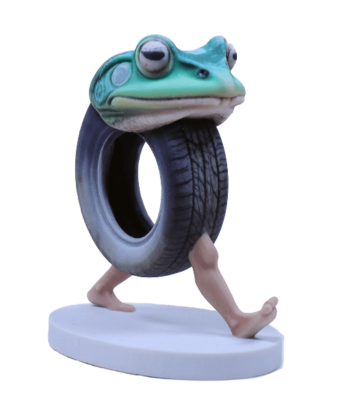 Whimsical frog-with-a-tire figurine