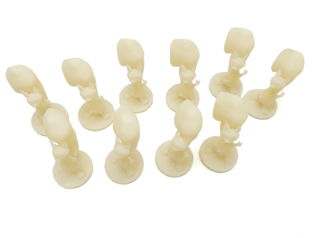 Batch of ten identical single-color resin figurines on round bases